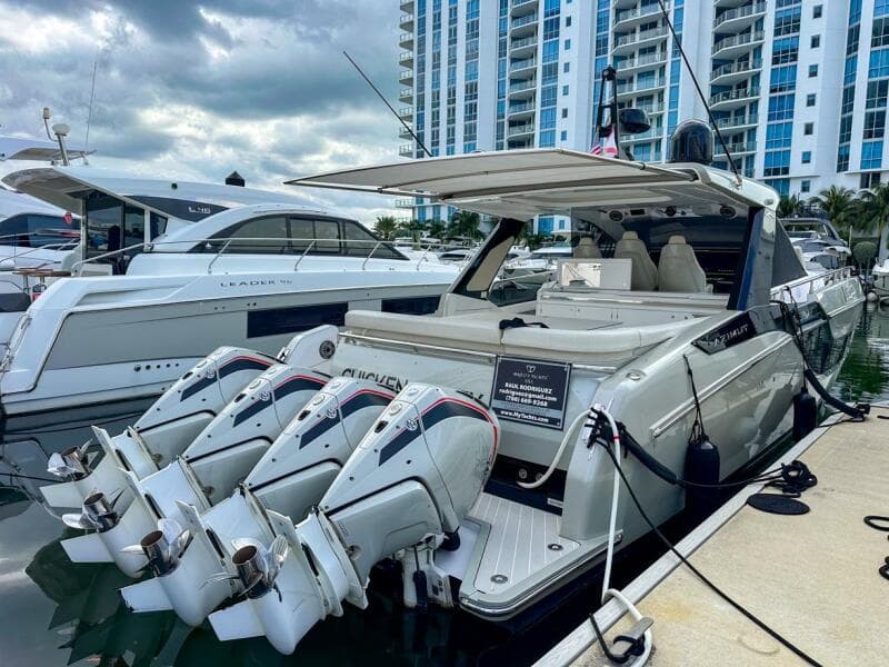2023 Azimut Verve 47 yacht docked, featuring four powerful outboard engines.