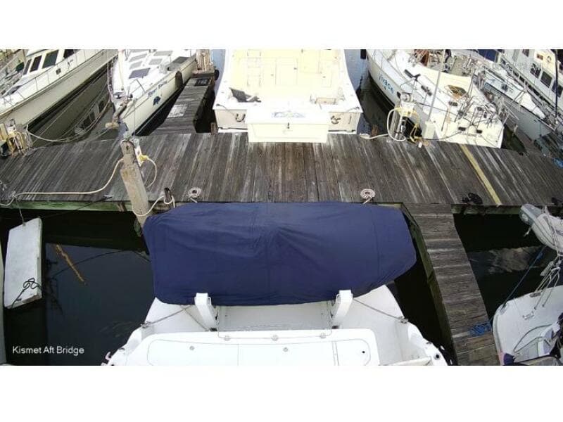 2006 Sea Ray 52 Sedan Bridge docked at marina, covered aft deck.