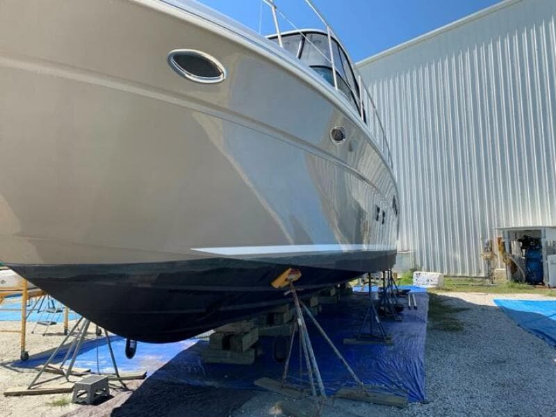 2006 Sea Ray 52 Sedan Bridge yacht on dry dock for maintenance.