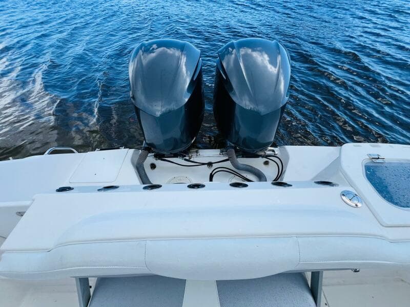 2012 Everglades 295 Center Console boat with dual engines on water.