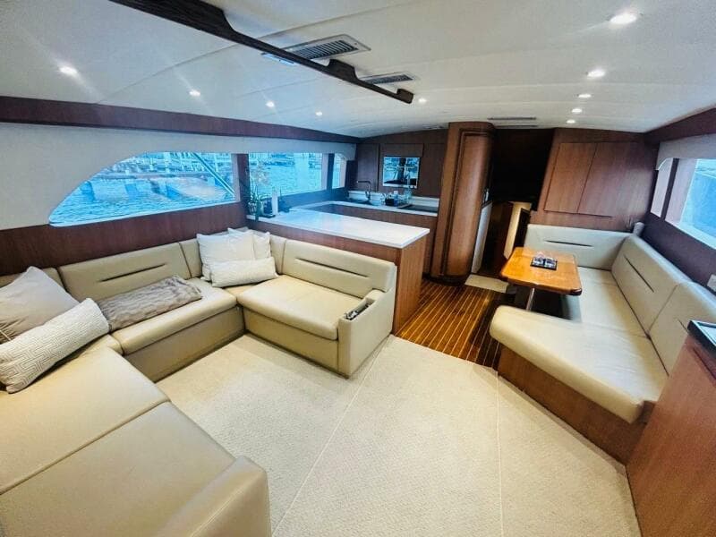Luxurious interior of a 1988 Bertram 54' yacht with spacious seating and modern design.