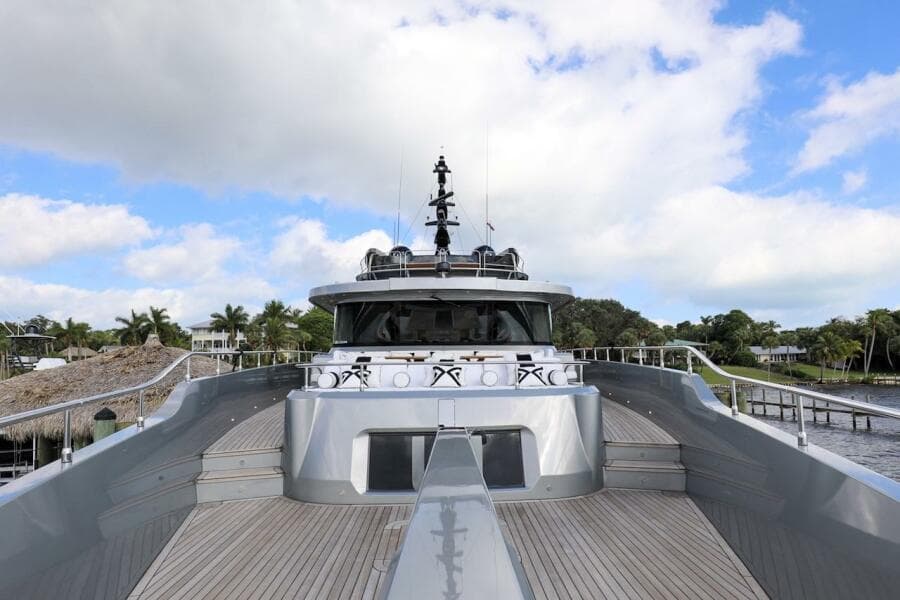 Majesty 120 yacht, 2025 model, sleek design, docked under blue sky.