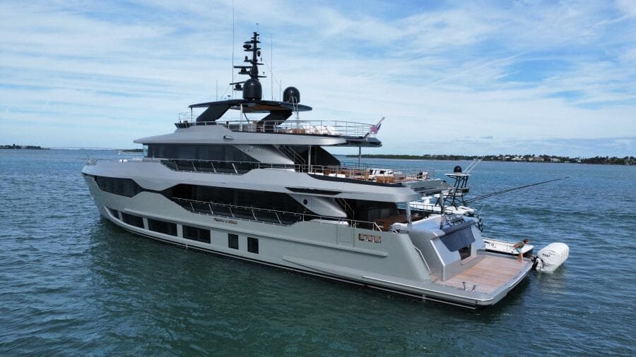 Luxury 2025 Majesty 120 yacht cruising on open water under a clear sky.