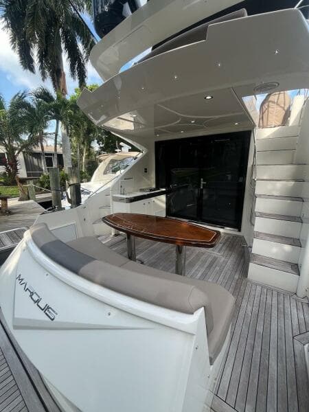 2017 Marquis 500 Sport Yacht deck with seating and table.