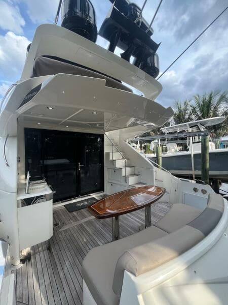 2017 Marquis 500 Sport Yacht with outdoor seating and table.