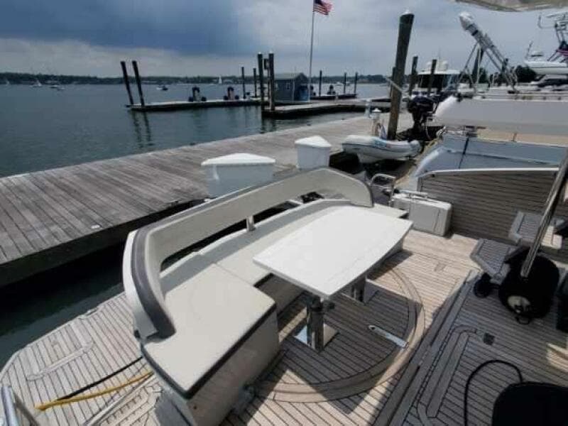 Galeon 500 Fly 2020 yacht docked, featuring a stylish outdoor seating area.