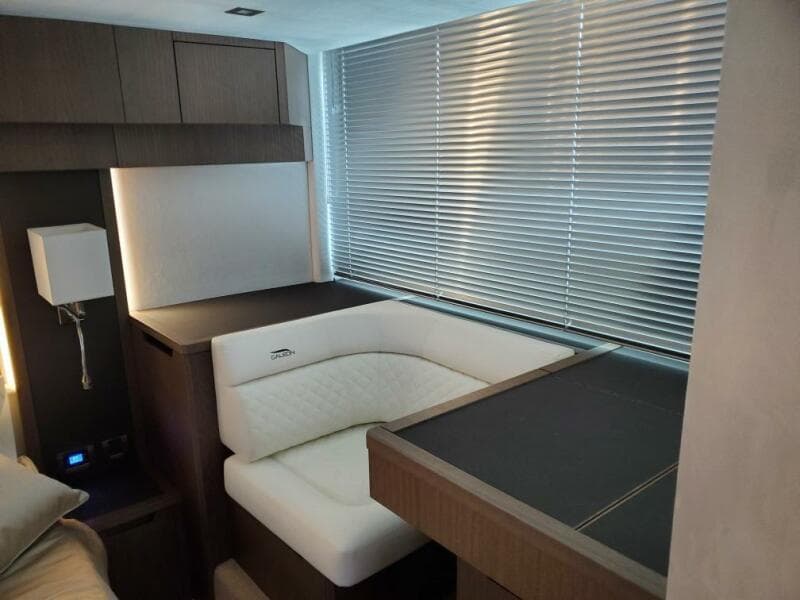 Interior of 2020 Galeon 500 Fly yacht with modern seating and blinds.