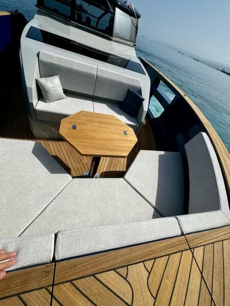 Luxurious 2025 Aicon Audace 50 yacht with elegant seating and wooden deck.