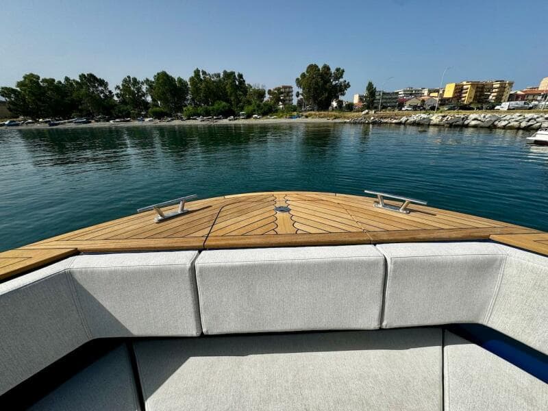 Aicon Audace 50 yacht bow, 2025 model, with sleek deck design and waterfront view.