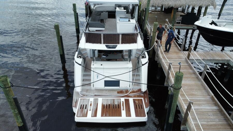 Aerial view of 2024 Aicon 66 Vivere yacht docked at a marina.