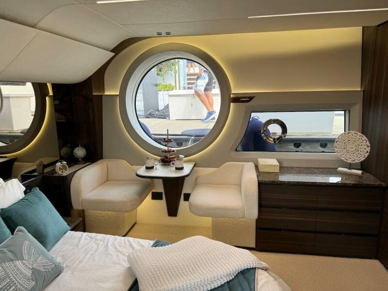 Luxurious interior of 2024 Aicon 66 Vivere yacht with elegant seating and decor.