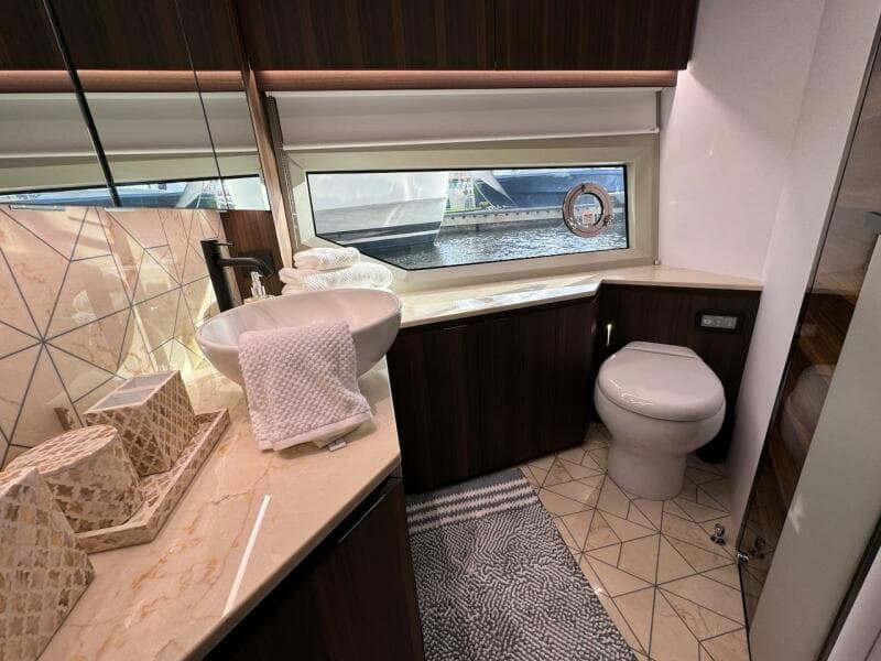 Luxurious bathroom interior of 2024 Aicon 66 Vivere yacht with modern fixtures.