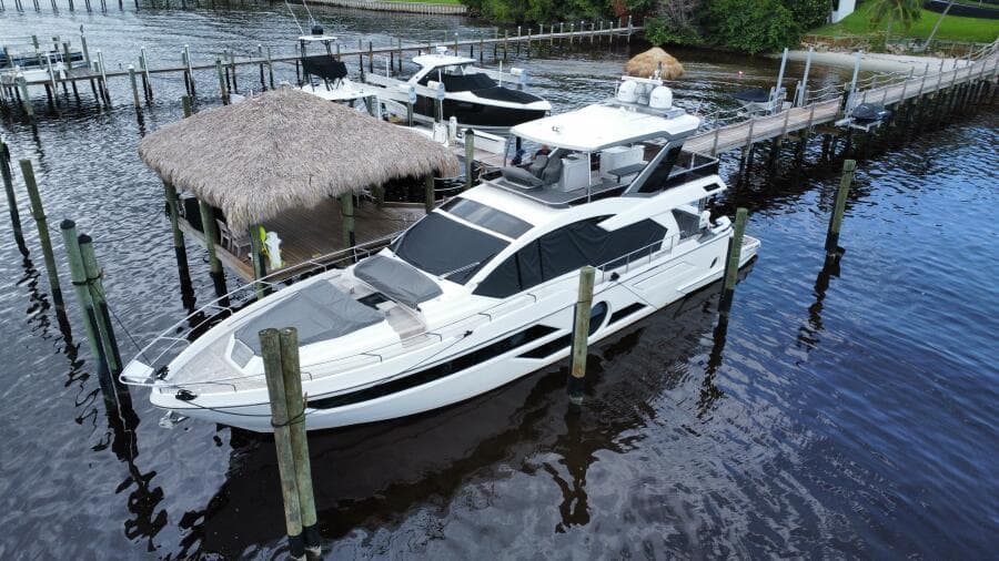 Luxury 2024 Aicon 66 Vivere yacht docked at marina.