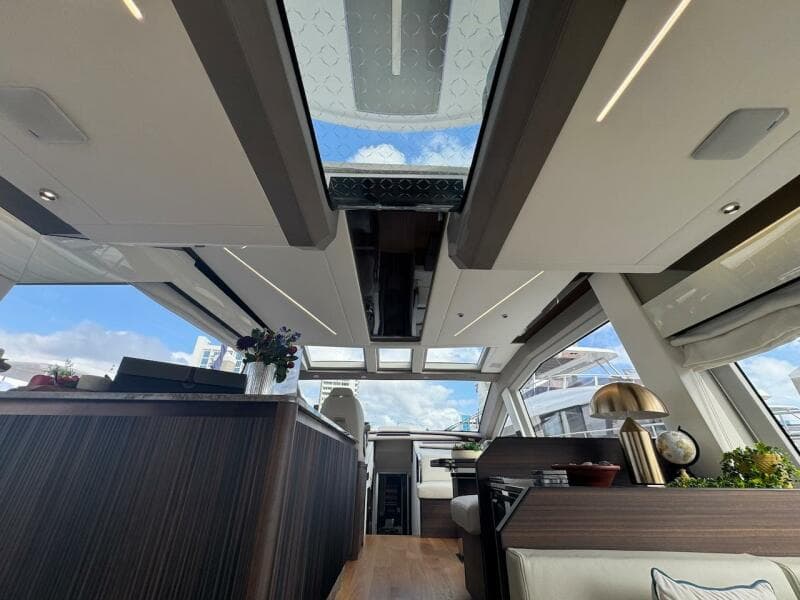 Luxurious interior of 2024 Aicon 66 Vivere yacht with skylight and modern design.