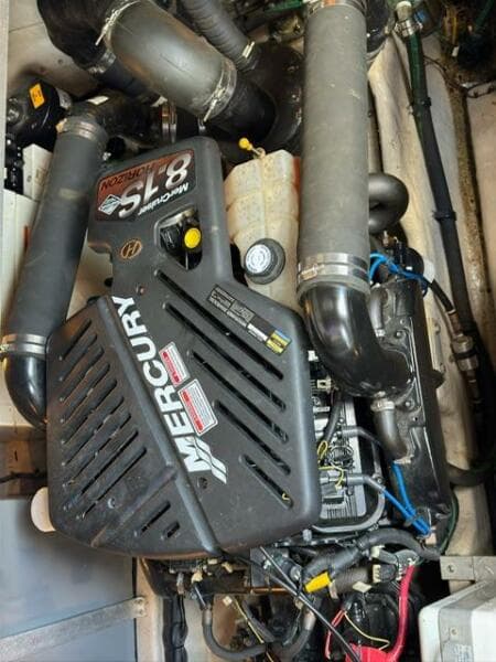 Mercury engine in 2003 Sea Ray 380 Sundancer boat, showcasing mechanical components.