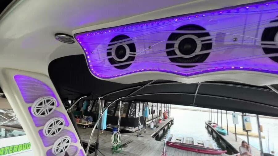 2003 Sea Ray 380 Sundancer with illuminated speakers and dock view.