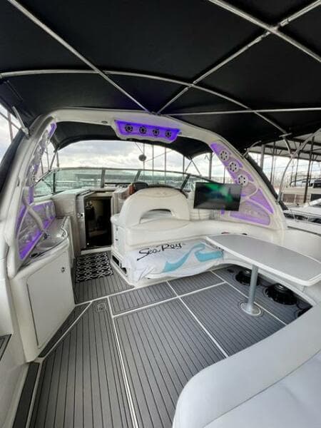 2003 Sea Ray 380 Sundancer yacht interior with modern seating and ambient lighting.