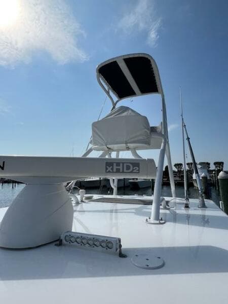 2020 SeaHunter 39 Tournament boat with radar and fishing equipment under a clear blue sky.