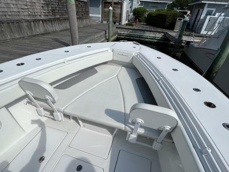 2020 SeaHunter 39 Tournament boat, spacious deck with seating, docked at marina.