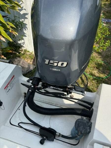 Yamaha 150 outboard motor on 2016 Release 208 RX boat, featuring SeaStar steering system.