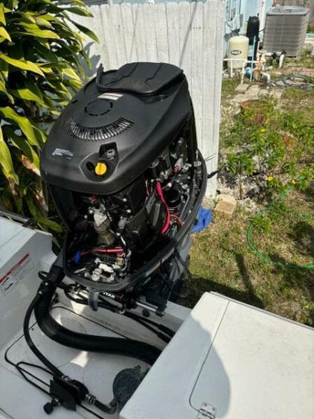 2016 Release 208 RX boat engine, open cover, outdoor setting.