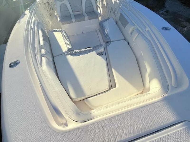 2014 Everglades 355 Center Console boat with spacious seating area and cushions.