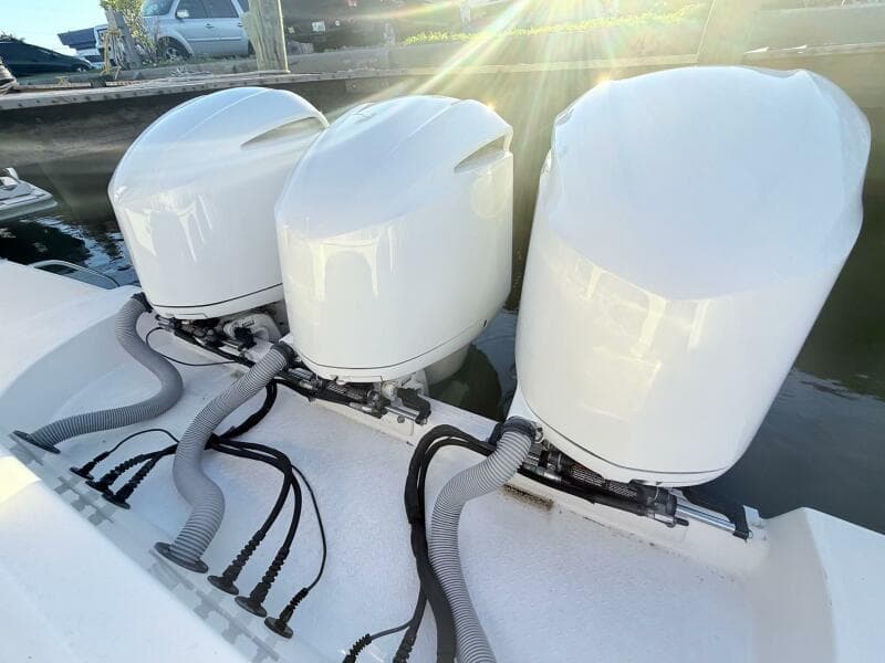 Triple outboard engines on a 2014 Everglades 355 Center Console boat.