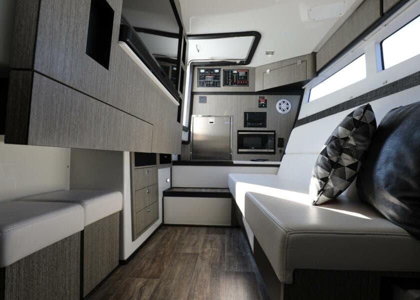 2023 Monterey 385 Super Sport interior with modern kitchen and seating area.