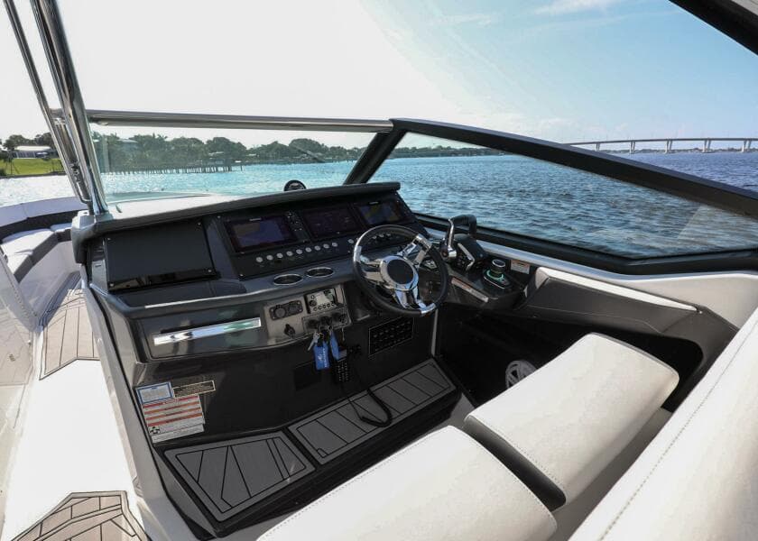 2023 Monterey 385 Super Sport boat interior with modern dashboard and steering wheel.