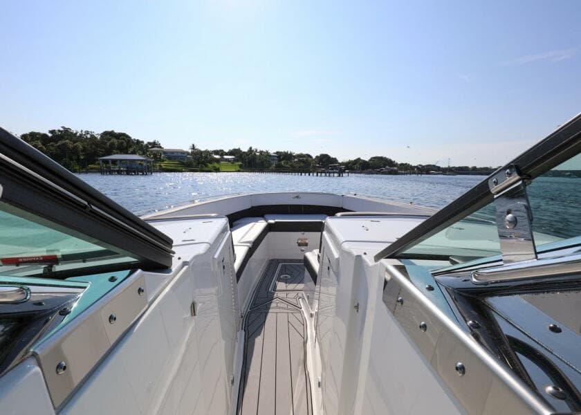 2023 Monterey 385 Super Sport boat cruising on a sunny day, showcasing sleek design and open water.