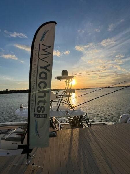 2024 Regulator 41 yacht at sunset, docked with MyYachts.com banner.