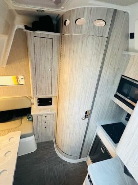 2024 Regulator 41 interior with modern kitchen and sleek cabinetry design.