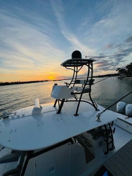 2024 Regulator 41 boat at sunset on a serene lake.