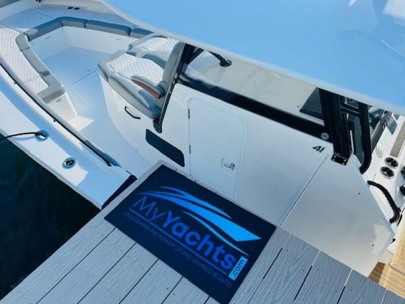 2024 Regulator 41 yacht docked with MyYachts.com mat on the pier.