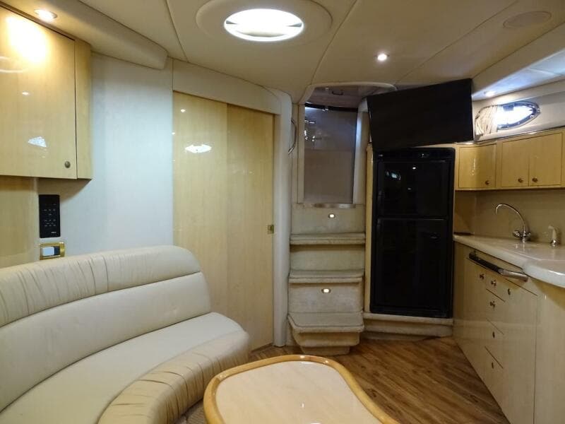Luxurious interior of 2001 Sea Ray 410 Sundancer yacht with modern amenities and elegant design.