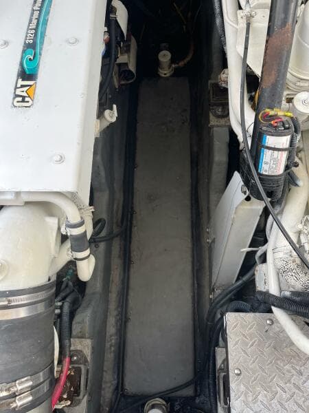 Engine compartment of a 2001 Sea Ray 410 Sundancer boat, featuring CAT components.
