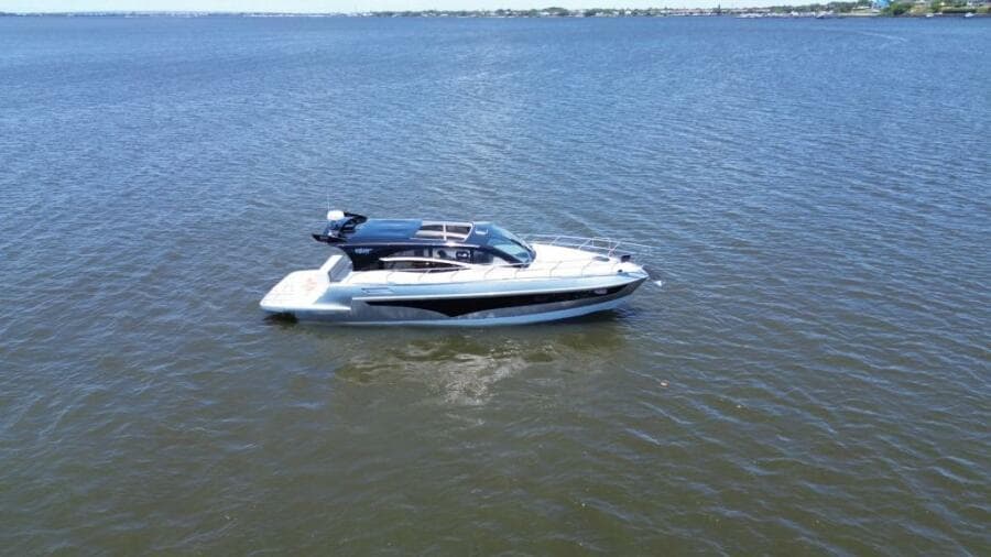 2025 Real 40 HT Luxury yacht cruising on open water.