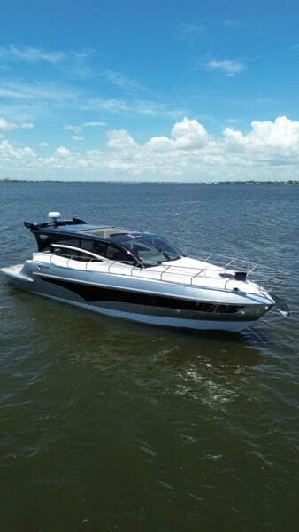 2025 Real 40 HT Luxury yacht cruising on a sunny day.
