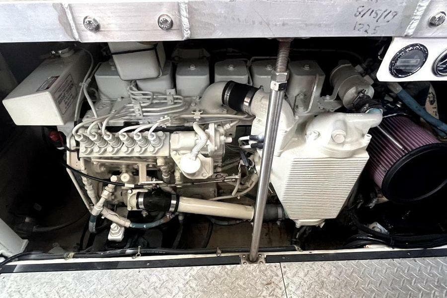 Engine compartment of a 2000 Carver 396 Motor Yacht, showcasing mechanical components.