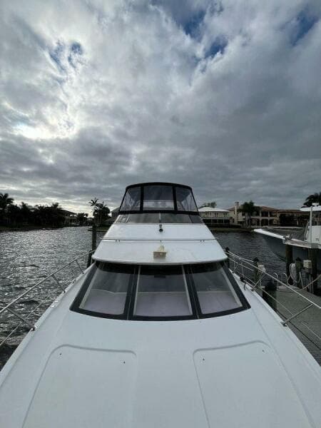 2000 Carver 396 Motor Yacht docked under cloudy skies.