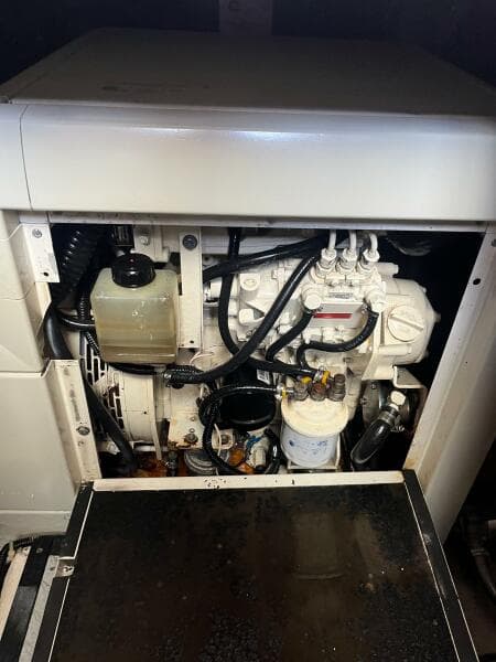 Engine compartment of a 2000 Carver 396 Motor Yacht, showcasing mechanical components.