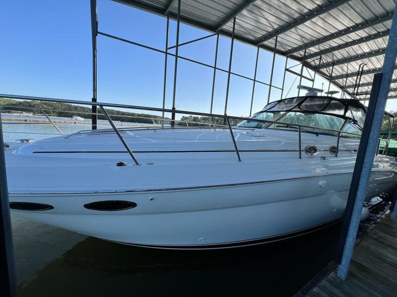 2001 Sea Ray 380 Sundancer docked under a covered marina.