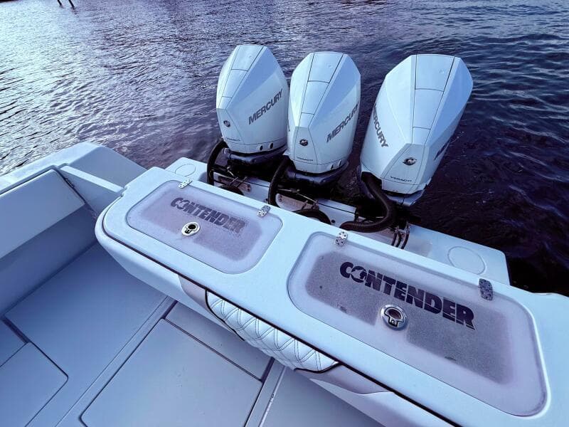 2024 Contender 39 ST boat with triple Mercury outboard engines on water.