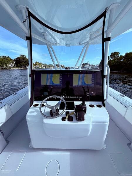 2024 Contender 39 ST boat cockpit with advanced navigation system and steering wheel.