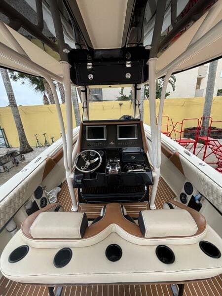 2013 Statement 35 Center Console boat interior with dual screens and steering wheel.