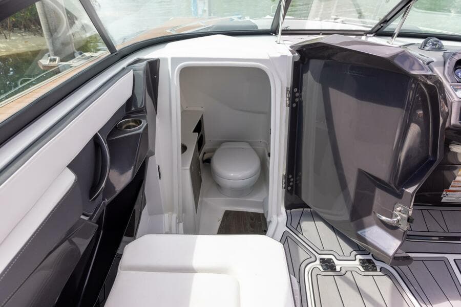 2023 Monterey 255 Super Sport boat interior with compact bathroom.