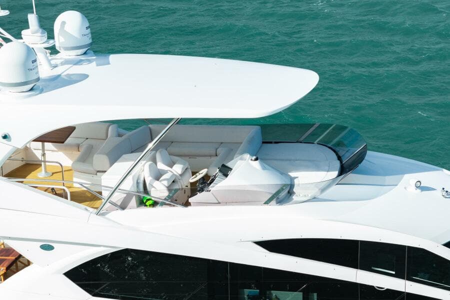 Sunseeker Manhattan 65 yacht, 2016 model, cruising on blue waters.