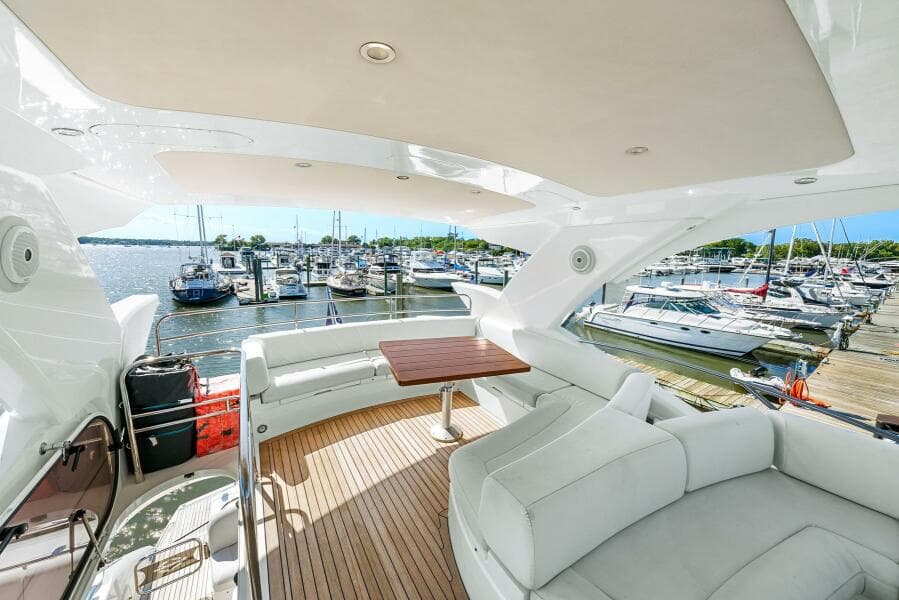 Luxurious 2016 Sunseeker Manhattan 65 yacht interior with marina view.