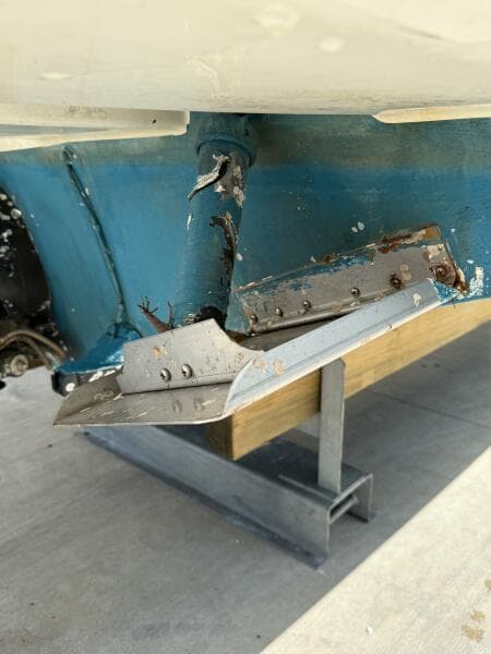 Damaged hull of 2014 Sea Ray 270 SLX boat on stand.