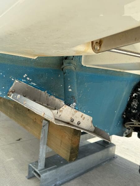 2014 Sea Ray 270 SLX boat hull on a stand, showcasing trim tab details.
